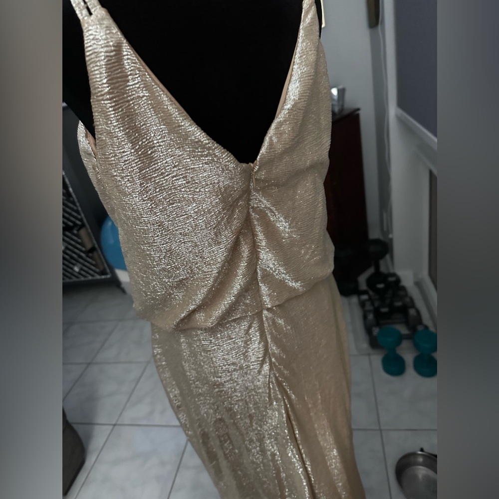 Beautiful, shimmering gold dress with thin straps. Perfect for any event.